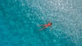Aerial photo of woman in blue water of Indian ocean