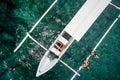 Aerial photo of young couple on holidays swimming in ocean