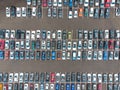 Aerial photograph. Large paved car parking. A lot of cars. No people. Abstraction. Travel, tourism, ecology, environmental