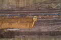 Aerial photograph of the laying pipe of large diameter in clay soil. Autumn