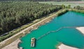 Aerial photograph of a suction dredger in a wet mining area for sand and gravel, with connected pipeline to remove the sand Royalty Free Stock Photo