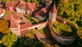 Aerial photography above a mdieval city with fortified walls and towers. Royalty Free Stock Photo