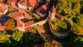 Aerial photography above a mdieval city with fortified walls and towers. Royalty Free Stock Photo