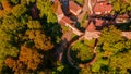 Aerial photography above a mdieval city with fortified walls and towers. Royalty Free Stock Photo