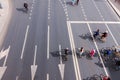 Aerial photography city active sport cycling festival with group of cyclist people on the road white line marking