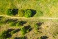 Aerial photography a dirt road in the middle of a fir forest from a dron Royalty Free Stock Photo