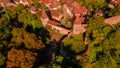 Aerial photography above a mdieval city with fortified walls and towers. Royalty Free Stock Photo
