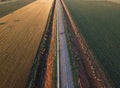 Aerial photography of road and arable crop land for wheat sunflower or corn in Serbia