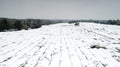 Aerial photography of the snowy scenery of ten thousand mu tea garden in Xuancheng, Anhui Province, China