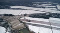 Aerial photography of the snowy scenery of ten thousand mu tea garden in Xuancheng, Anhui Province, China