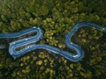 Twisty mountain road seen from above. Aerial view