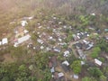 Aerial photos of small towns In Thailand, surrounded by arid fields, there is a road through