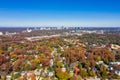 Aerial picture of houses in Midtown Atlanta during the fall with Buckhead buildings in the background