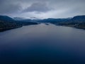 The drone picture of cloudy and foggy Lake Teletskoye in Altai mountains forests in Russia Royalty Free Stock Photo