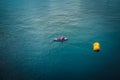 Aerial picture of a man kayaking in the mediterranean sea