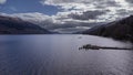 Aerial of a pier on a cloudy day in Loch Lomond, Scotland Royalty Free Stock Photo