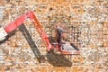 Aerial platform for repairing works against a brick wall