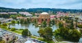 Aerial pond around open rotunda and colonnade of Palace of Fine Arts with Roman ruins vibe