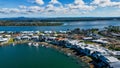 Aerial Port Macquarie city view, Australia, with moored boats and yachts, and houses on the coast