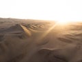 Aerial postcard panorama sunset view of isolated lonely single man person dry sand dunes desert of Huacachina Ica Peru Royalty Free Stock Photo