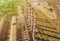 Aerial power electrical plant with high industrial pipes on a summer day f