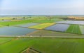 Aerial: rice paddies, flooded cultivated fields farmland rural italian countryside, agriculture occupation, sprintime in Piedmont, Royalty Free Stock Photo