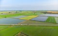 Aerial: rice paddies, flooded cultivated fields farmland rural italian countryside, agriculture occupation, sprintime in Piedmont,