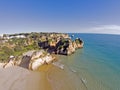 Aerial from rocks and ocean at Praia tres Irmaos in Algarve Port Royalty Free Stock Photo