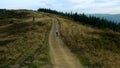 Aerial rocky road biking male view sport natural activity against cloudy sky