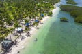 Aerial of a rustic tropical resort with a coconut tree lined beach at Pangangan Island, Calape, Bohol, Philippines Royalty Free Stock Photo