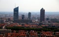 Aerial scenic view of a Lyon city center with orange roofs and skyscrapers.