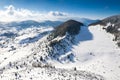 Aerial scenic rural view of the winter landscape from Fundata village in Romania at the bottom of Bucegi Mountains Royalty Free Stock Photo