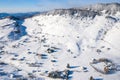 Aerial scenic rural view of the winter landscape from Fundata village in Romania at the bottom of Bucegi Mountains Royalty Free Stock Photo