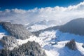 Aerial scenic rural view of the winter landscape from Fundata village in Romania at the bottom of Bucegi Mountains Royalty Free Stock Photo