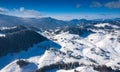 Aerial scenic rural view of the winter landscape from Fundata village in Romania at the bottom of Bucegi Mountains Royalty Free Stock Photo