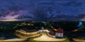 aerial seamless spherical 360 night panorama overlooking old town, historic buildings and medieval castle at sunset in