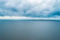 Small patch of land on the horizon - tranquil overcast scene. Royalty Free Stock Photo