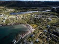 Aerial East coast community overlooking distant rugged terrain and lakes with shoreline homes at Keels Newfoundland Canada Royalty Free Stock Photo