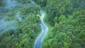 Aerial of self driving autonomous electric car with autopilot driving on a road