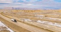 AERIAL: Semi-trailer trucks drive up and down the scenic motorway in Utah.