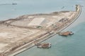 aerial shoot of a lake coast with sand mining