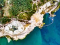 Aerial shoot of a lake coast with sand mining