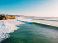 Aerial shooting of big stormy waves at sunset. Ocean waves in Bali Royalty Free Stock Photo