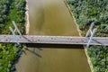 Aerial shooting from flying drone car traffic on modern highway bridge over river Royalty Free Stock Photo