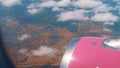 Aerial Shot Through The Airplane Window - White Beautiful Cloudy Sky - City View Royalty Free Stock Photo