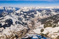 Aerial shot of an amazing snowy landscape under the sunlight