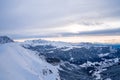 Aerial shot of an amazing snowy landscape under the sunlight