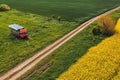 Aerial shot of apiary truck with colorful beehive wooden crates in trailer