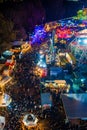 Aerial shot of an attraction park with lots of people during the night