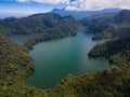 Aerial shot of Balinsasayao Twin Lakes, Negros Oriental, Philippines surrounded by lush green forest